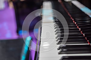 Piano keys on black classical grand piano