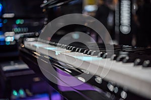 Piano keys on black classical grand piano