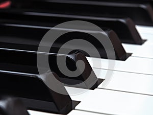 Piano keys close-up. A grand piano keyboard. The shallow depth of field. Selective focus