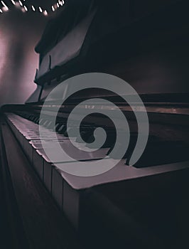 Piano keys with dramatic lighting, close-up, vertical, background for a concert poster photo