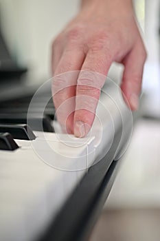 Piano Keys And Man Finger