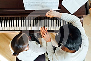 Piano lesson at a music school photo