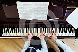 Piano lessons at a music school, teacher and student