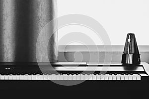 Piano with metronome. Music instrument. Art and abstract background