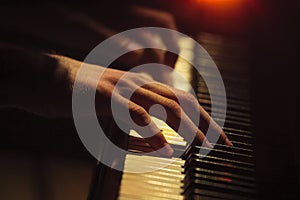 Piano player hands on the keyboard