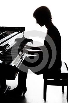 Piano player. Pianist playing grand piano