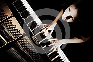 Piano player. Pianist playing grand piano concert photo