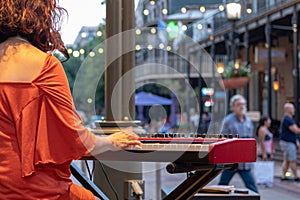 Piano player playing electric piano in New Orleans