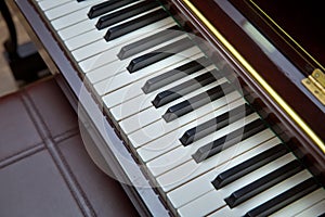 Piano presses . Piano keys close up. Musical instrument . Select focus and soft focus.Close-up of a wooden piano . Defocused