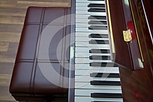 Piano presses . Piano keys close up. Musical instrument . Select focus and soft focus.Close-up of a wooden piano . Defocused