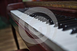 Piano presses . Piano keys close up. Musical instrument . Select focus and soft focus.Close-up of a wooden piano . Defocused