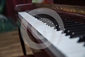 Piano presses . Piano keys close up. Musical instrument . Select focus and soft focus.Close-up of a wooden piano . Defocused