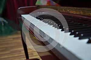 Piano presses . Piano keys close up. Musical instrument . Select focus and soft focus.Close-up of a wooden piano . Defocused