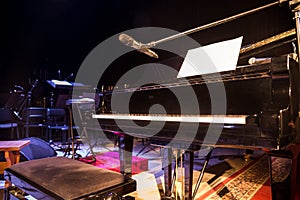 Piano on stage.Empty chairs stand on stage in Concert Hall. Scene symphony concert hall.European scene, a concert of symphonic mu