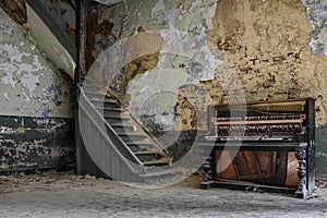 Piano by a staircase