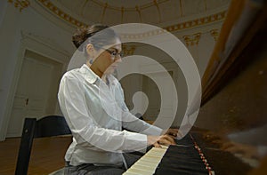 Piano Teacher Playing From Keyboard Viewpoint