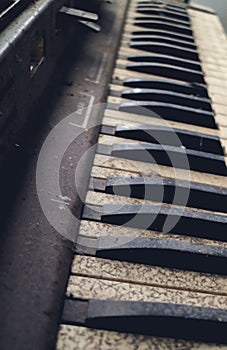 The piano vintage with electronic dilapidated in storage room