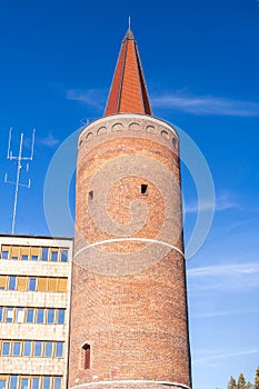 Piast Tower in Opole on blue sky and fragment of the Opole Voivodeship Office, Poland