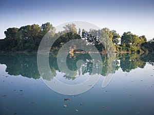 Piave river in flood seen at sunset  from San DonÃ  di Piave-Venice Italy