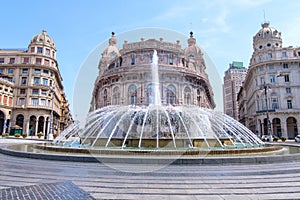 Piazza De Ferrari fountain with buildings photo