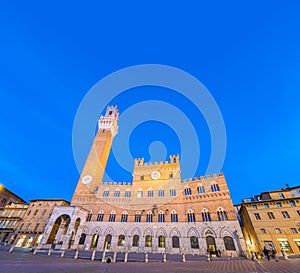 Piazza del Campo at sunset with Palazzo Pubblico, Siena, Italy