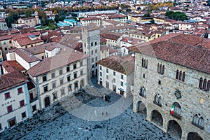 Piazza del Duomo, the main square of Pistoia historic center, Tuscany, Italy against a blue sky