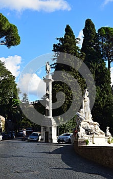 Piazza del Popolo with the Fontana della Dea di Roma, looking up at the Baclonata del Pincio in Rome, Italy