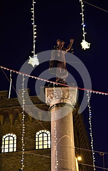 In the Piazza della Santa TrinitÃ  in Florence, the statue of a female figure holding a balance in her left hand and a sword in th