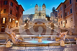 Piazza di Spagna, the Spanish Steps and the Fontana della Barcaccia in Rome in the night highlighting