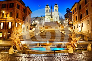 Piazza di Spagna with the Spanish Steps and the Fontana della Barcaccia under the moon photo