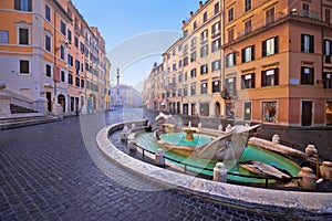 Piazza di Spagna square and Fontana della Barcaccia fountain in Rome morning view