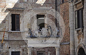 Piazzetta dei Grifi et dei Leon square sculpture details of Medieval Montepulciano from VaL D`Orcia. Tuscany region. Italy