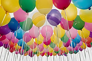 Pic Colorful helium balloons isolated on white background, celebration