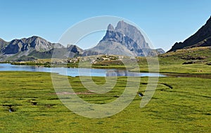 Pic du Midi d Ossau reflecting in Anayet lake, Spanish Pyrenees, Aragon, Spain