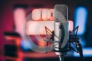 Pic Studio condenser microphone on blurred background, audio equipment photo