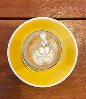 Piccolo latte on yellow plate