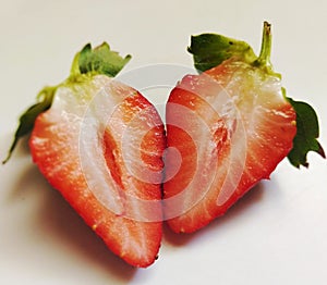 pices of strawberry on white bacground photo