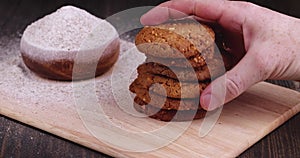 pick up oatmeal cookies on a wooden board