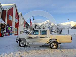 Pick up truck cars, buildings tourism in winter, Balestrand, Norway