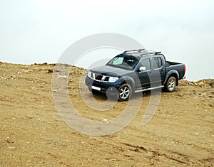 Pick-up truck on road photo