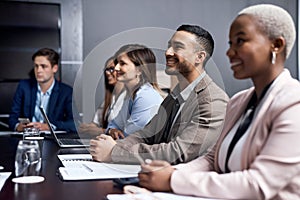 Pick your best move. a group of businesspeople having a meeting in a boardroom.