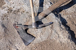 Pickaxe and axe, tools in an archaeological excavation. Archeology