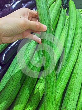 Picking loofah in supermarket