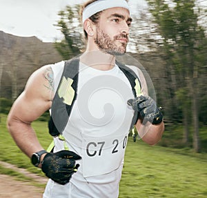 Picking up the pace. a handsome young male athlete out for a morning run in the mountains.