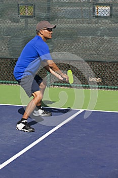 Pickleball Action - Man in Blue Guarding the Sideline During A Match