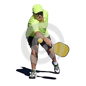 Pickleball Action - Senior Male Player Hitting Backhand photo