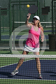 Pickleball - Female Hitting Ball At Net