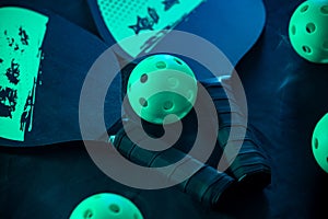 Pickleball game set. Rackets and balls on the court. Copy space. Sports background.