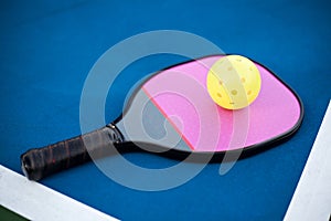 Pickleball paddle and ball photo