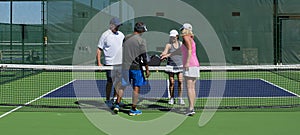 Pickleball - Two Couples Congratulating Each Other After A Game Well Played